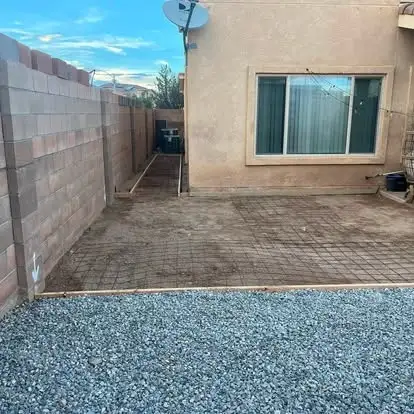 Same yard with gravel and a reinforced pad formed for concrete